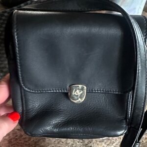 Leather Crossbody Bag in Black with Metal Crest